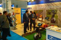 Attendees of the Eurasia Rail-2019 exhibition look at the ultrasonic single rail trolley UDS2-77 at the OKOndt Group's booth