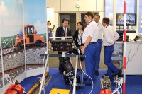 Demonstration of the double rail ultrasonic flaw detector UDS2-73 to the visitors of the InnoTrans-2018 Exhibition
