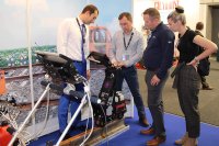 Specialist of OKOndt Group shows the InnoTrans-2018 visitors how the single rail trolley UDS2-77 works 