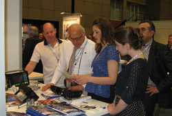Professor Giuseppe Nardoni looking at the flaw detectors made by OKOndt GROUP at WCNDT-2012, Durban, South Africa